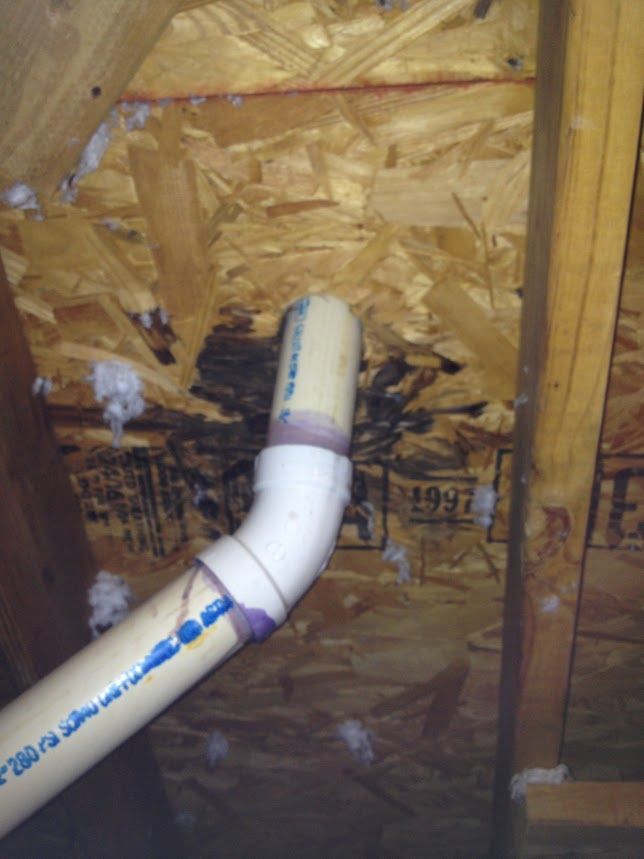 Roof leak water intrusion around plumbing penetration in roof decking